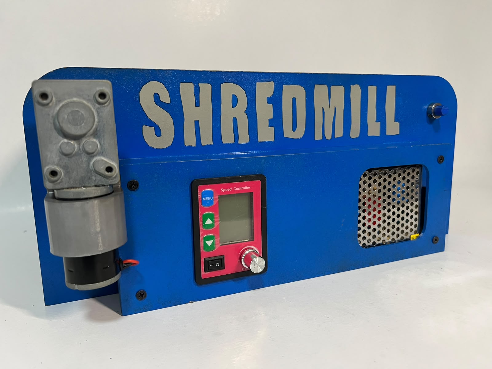 Front view of the blue Shredmill base with its motor and speed control