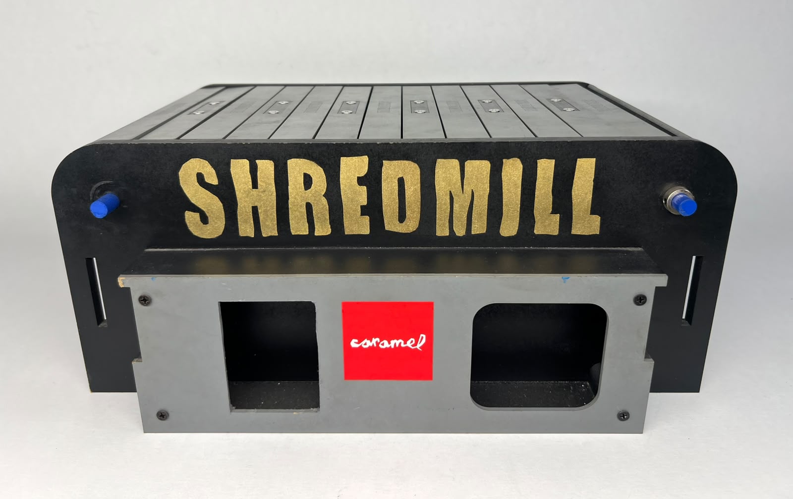 Front view of Shredmill with gold lettering and a Caramel badge